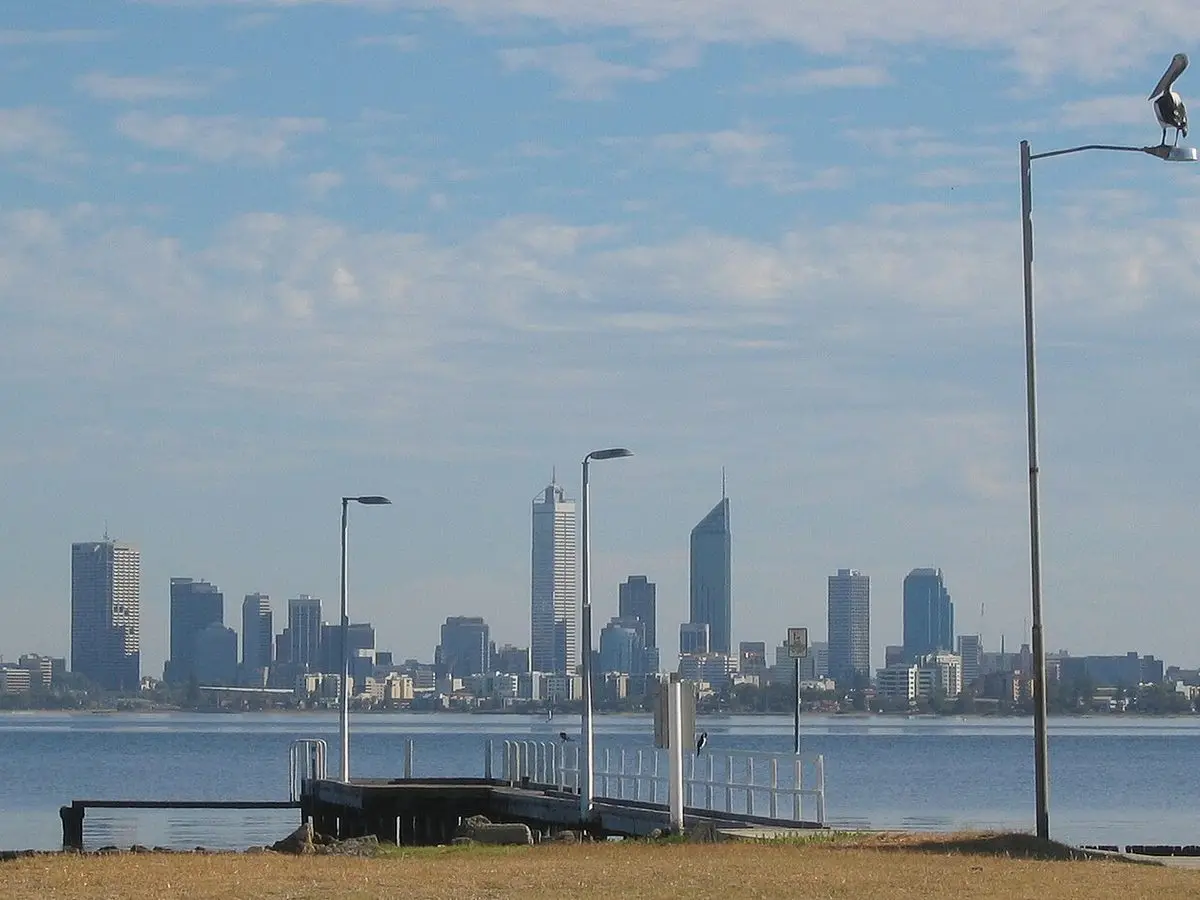 Applecross Jetty on the Swan River with the Perth city skyline behind