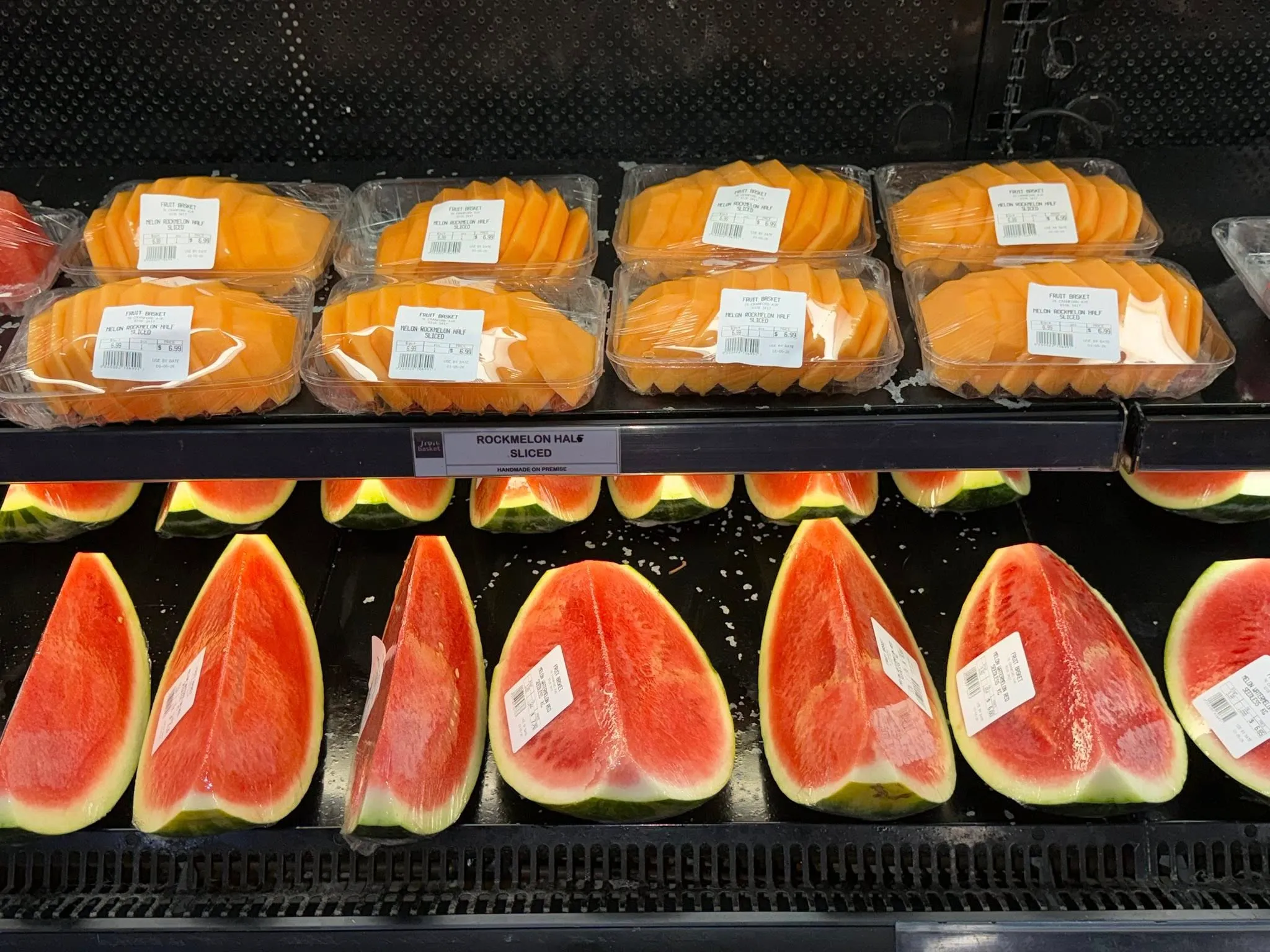 Charcuterie board with sliced cured meats and watermelon