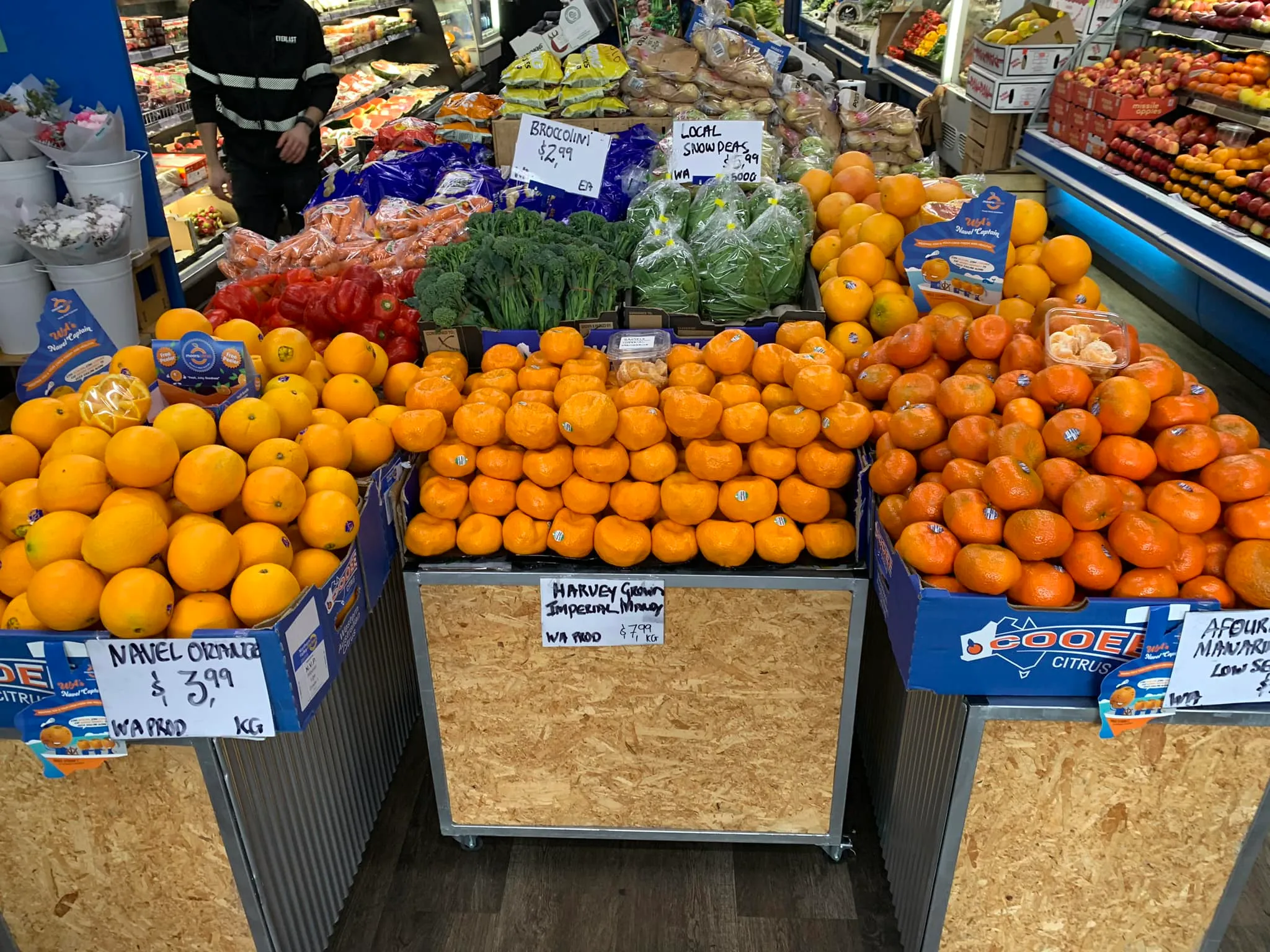 Inside the shop with citrus and produce stacked floor to ceiling