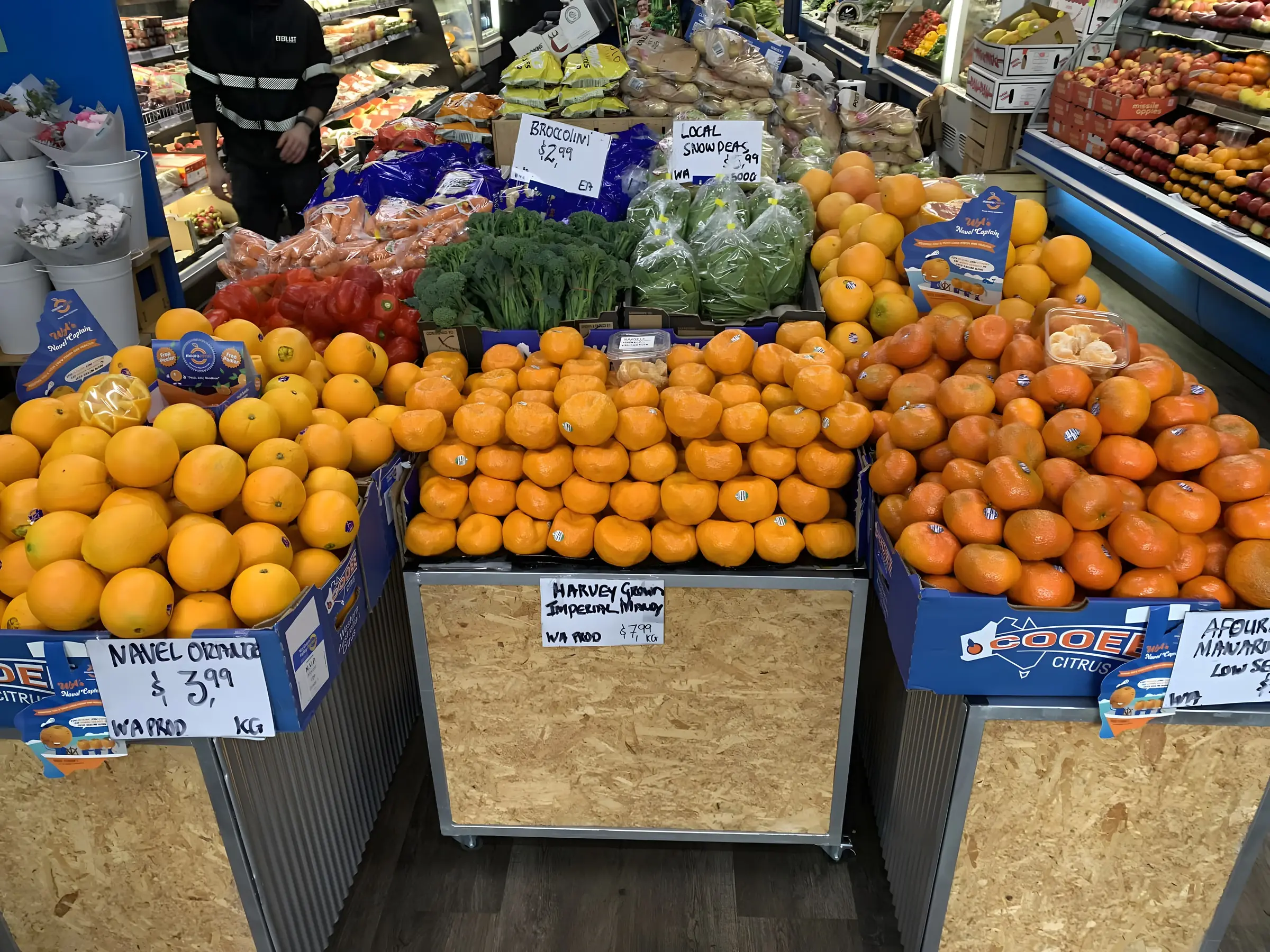 Inside the shop with citrus and produce stacked floor to ceiling