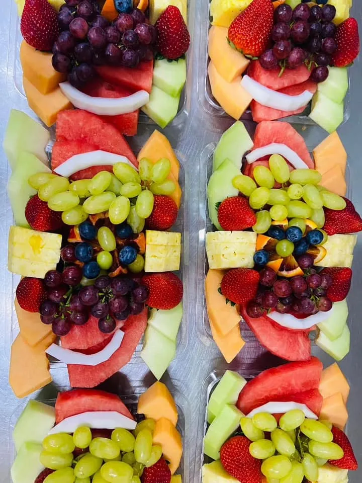 Twin fruit and cheese skewer platters with grapes, berries and melon